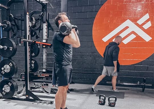 21 Day Offer - Man lifiting weights in gym