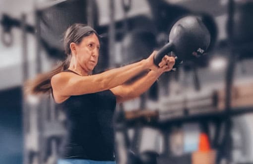 Woman Swinging Kettle Bell